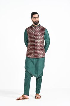 Bottle green criss cross jhaal embroidered on Modal silk with zari stitchline, pintuck and assymetrical hemline kurta. Paired with bottle green slim fit Pant Pajama. Color of the actual garment may vary due to lighting conditions during the shoot.
 

Size Chart For Men





	
	
					Men's Size Chart
		

		
		
						
				Size Chart For Men
				Custom Size Measurement Guide
			
			
				
				
				Custom Size Measurement Guide
1. Take your measurements at ease…don’t hold your breath!
2. Be a little Traditional Green Silk Sherwani, Designer Green Silk Sherwani, Designer Chanderi Kurta For Eid, Designer Chanderi Kurta For Festive Occasions, Green Chikankari Embroidery Kurta In Raw Silk, Festive Designer Chanderi Kurta, Festive Green Chanderi Bandhgala, Green Chanderi Nehru Jacket Straight Kurta, Green Chanderi Nehru Jacket In Straight Kurta Style