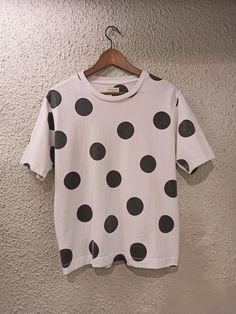 Dries van noten polka dot Printed Cotton t-shirt  %100 Cotton Crew Neckline  Straight hem Semi FITTED Big dot Printed  Mid weight Short sleeve  Washed out  Dots color is not Black ,it is dark gray Color : White   There is a Small print defect on one of back polka dot  .no holes or any other defect Size : Small Pit to pit: 49cm Length: 62cm Brand New UNUSED  Inside care label is missing  iron inside out  Worldwide shipping Via registered airmail Cotton T-shirt With Polka Dot Pattern And Short Sleeves, Polka Dot Cotton T-shirt With Short Sleeves, Polka Dot Short Sleeve T-shirt For Spring, Summer Polka Dot Crew Neck Top, Relaxed Fit Cotton Polka Dot Tops, Dark Gray Color, Dark Grey Color, Small Print, Dries Van Noten