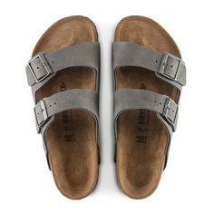 An icon of timeless design and legendary comfort, the Arizona sandal has been defining style since 1973. Grained nubuck leather brings distinct character to the classic, two-strap look. Complete with legendary BIRKENSTOCK design elements, like a contoured cork-latex footbed for the ultimate in support. Contoured cork-latex footbed creates custom support with wear Grained nubuck leather upper Suede footbed lining helps keep you comfortable EVA sole is flexible and lightweight Two adjustable strap Classic Double Strap Sandals With Leather Footbed, Classic Suede Sandals With Cushioned Footbed, Classic Brown Sandals With Suede Lining, Classic Suede Sandals, Classic Leather Sandals For Outdoor, Classic Sandals With Leather Footbed For Outdoor, Classic Suede Sandals With Leather Sole, One Strap Birkenstocks, Men’s Birkenstock Arizona Outfit