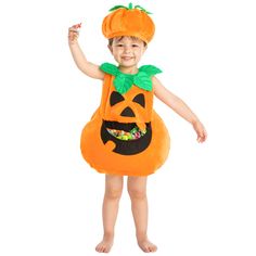 a little boy dressed in a pumpkin costume