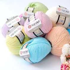 several balls of yarn sitting next to each other