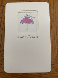 a card with an image of a pink umbrella on it and the words, showers of wishes