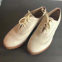 Cream Leather Uppers Deep Tan/Burnt Orange Sole Cream Laces Never Worn Box Not Included Excellent Condition! Cushioned Oxfords With Round Toe For Office, Office Oxfords With Cushioned Footbed And Round Toe, Classic Beige Lace-up Oxfords, Classic Flat Oxfords With Brogue Detailing, Beige Oxfords For Spring Formal, Beige Oxfords For Spring Formal Occasions, Classic Flat Lace-up Shoes For Office, Beige Formal Oxfords For Spring, Spring Beige Formal Oxfords