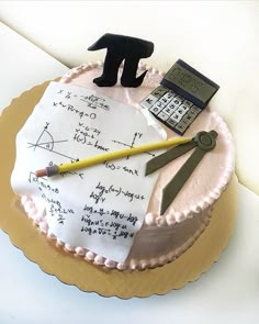 a cake with writing and a calculator on it