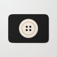 a black and white photo of a button with two buttons on the front of it