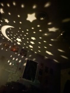 the ceiling has many stars and moon shadows on it