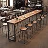 an empty restaurant with many tables and stools