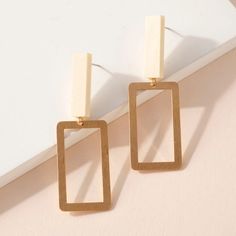 Super chic look earrings. Metal rectangular dangling earrings with rectangular wood post. Approx: 2.5" Material: Zinc, Brass, Gold Plated, Wood. Nickel Free. Ivory Earrings, Wood Post, Earrings Metal, Brass Gold, Dangling Earrings, Brown Gold, Wall Lights, Gold Plate, Dangle Earrings