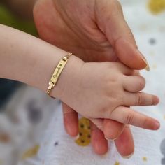 Introducing our Gold Personalized Baby Bracelet with Name. Designed for the arrival of a new life. This bracelet is made with attention to detail and is both elegant and meaningful. It's great for keeping during a child's early years. PRODUCT DETAILS: Material: 14K Solid Gold or 14K Gold Plated Bracelet Length: 4.5 inches (extension chain 1.5 inches) Adjustable gold extension chain Style: Minimalist Gold Baby Bracelet, Personalized Adjustable 14k Gold Bracelets, Classic Adjustable Gold Bracelet With Name Detail, Classic Adjustable Gold Bracelet With Name, Adjustable 14k Gold Bracelet With Birthstone, Classic Hypoallergenic Bracelets As Personalized Gift, Classic Hypoallergenic Bracelets For Personalized Gifts, Personalized Adjustable Gold Bracelet For Everyday, Customizable Adjustable 14k Gold Name Bracelet