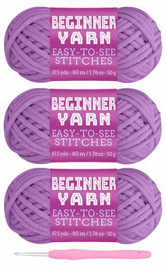 three skeins of yarn with the words beginner yarn written on them in pink