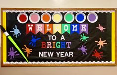 a welcome to a bright new year sign with crayons and paint on it