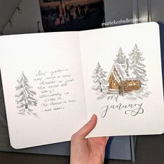 someone is holding up an open notebook with christmas trees on it and the words january written in cursive writing