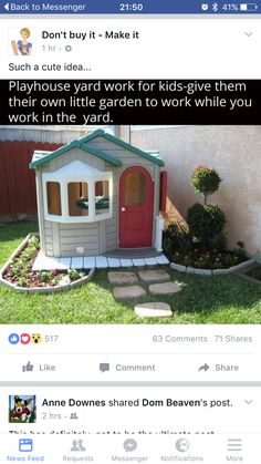 a small house with a red door in the grass next to a brick walkway and potted plant