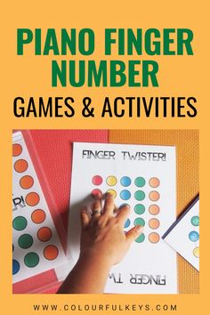 a child's hand writing on a sheet of paper with the words piano finger number games and activities