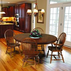 a kitchen and dining room with hardwood floors