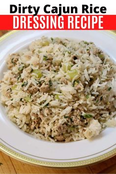 a white plate topped with rice and meat