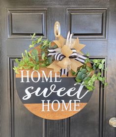 a door hanger that says, home sweet home on the side of a front door