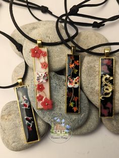 Designed with a nod to Japanese culture, these artisan necklaces are a tribute to the stunning landscapes and rich mythology of Japan. Though they might seem like the perfect accessory for 'the lads,' they are, in truth, crafted for anyone who appreciates beauty and artistry.  Made of resin, every detail in these necklaces has been meticulously handcrafted and thoughtfully assembled to capture the essence of Japanese aesthetics. Japanese Necklace Traditional, Artistic Red Pendant Jewelry, Artistic Red Necklace For Gift, Red Artistic Design Jewelry For Gift, Black Jewelry With Artistic Design As Gift, Artistic Flower Pendant Jewelry Gift, Artistic Flower Pendant Necklaces For Gifts, Unique Decorative Necklace For Gifts, Gift Necklace With Artistic Design