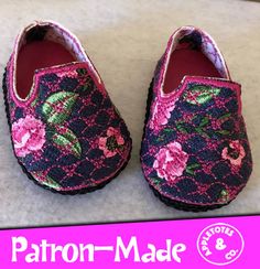 two pairs of shoes with pink flowers on them