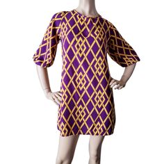 New Without Tags. Retro/Vintage Mod Style Dress In A Geometric Print In Purple & Gold With An Oval Open Back With Ties , Non Stretch. 100%Polyester Measurements (Appx): Armpit To Armpit =17.5" Length=33.5" Purple Knee-length Mini Dress For Daywear, Vintage Purple Knee-length Dress, Retro Mini Length Purple Dress, Vintage Purple Dress For Fall, Purple Vintage Dress For Fall, Retro Purple Mini Dress, Vintage Purple Fall Dresses, Vintage Purple Mini Dress, Mod Style