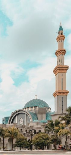 a tall building with a blue dome on top