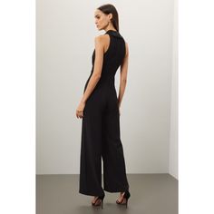 Black crepe (91% Polyester, 9% Elastane). Jumpsuit. Sleeveless. V-neck. Back zipper closure. 60" from shoulder to hemline. 33" inseam. 13" rise. 26.5" leg opening. Imported. Elegant V-neck Elastane Jumpsuits And Rompers, V-neck Elastane Jumpsuit For Work, Elegant Formal Jumpsuits And Rompers, Sleeveless Elastane Jumpsuit For Evening, Sleeveless Elastane Jumpsuits And Rompers For Date Night, Fitted Elegant Jumpsuits And Rompers With Back Zipper, Elegant Fitted Jumpsuits And Rompers With Back Zipper, Elegant Fitted Jumpsuit With Back Zipper, Elegant V-neck Elastane Jumpsuit Or Romper