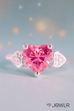 Celebrate romance and love. This enchanting, heart-shaped promise ring is the perfect girlfriend gift or a treat for yourself. 100% customizable with stones, metal, or engraving for a one-of-a-kind ring.  #Jewlr #HeartRing #PromiseRing #BirthstoneJewelry #LoveRing #LoveJewelry Cute Promise Rings Girlfriends, Elegant Pink Heart Ring For Proposal, Cute Pink Heart Ring Gift, Pink Heart Ring With Center Stone As Gift, Pink Heart-shaped Promise Ring Jewelry, Pink Heart-shaped Diamond Promise Ring, Personalized Promise Rings, Cute Promise Rings, Heart Promise Rings