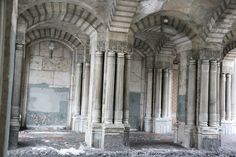 an old building with columns and arches