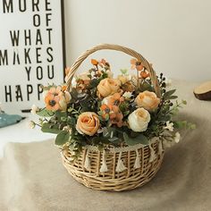 a basket filled with flowers sitting on top of a table