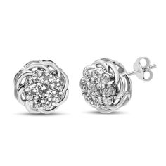 Clusters of brilliant round diamonds nestled within prong settings adorn this pair of openwork floral stud earrings for shimmering splendor. Polished .925 sterling silver is a sophisticated partner to these sparkling diamonds that total 1/2 cttw with an approximate I1-I2 Clarity and I-J Color. These clusters exibit a stunning design with singular round center stone haloed by additional round diamonds. These stylish fashion earrings secure with push back findings for secure, all-day wear. Silver Brilliant Cut Cluster Earrings, Silver Cluster Earrings With Diamond Accents, Silver Prong-set Round Cut Cluster Earrings, Silver Cluster Earrings With Prong Setting For Anniversary, Silver Cluster Earrings With Prong Setting, Elegant Silver Cluster Diamond Earrings, Silver Cluster Diamond Cut Earrings, Silver Cluster Sterling Silver Diamond Earrings, Silver Diamond Cluster Earrings