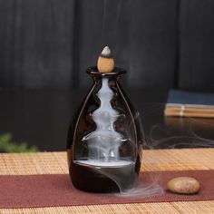 an incense burner sitting on top of a table