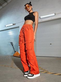 Make a bold fashion statement with these Orange Waist Flap Pocket Cargo Pants. Their plain pattern and high waistline add a touch of sophistication to your casual look. The drawstring waist ensures a comfortable fit, while the non-stretch fabric offers durability. These long-length pants are ideal for any occasion, and the waist flap pockets add a trendy twist. Details: Color: Orange Style: Casual Pattern Type: Plain Type: Cargo Pants Closure Type: Drawstring Waist Waist Line: High Waist Length: Urban Style Summer Cargo Pants With Elastic Waistband, Trendy Non-stretch Parachute Pants With Cargo Pockets, Urban High Waist Parachute Pants For Summer, Urban High-waist Parachute Pants For Summer, Relaxed Fit Orange Pants With Pockets, Orange Relaxed Fit Pants With Pockets, High Waist Summer Cargo Pants With Drawstring, High Waist Drawstring Cargo Pants For Summer, Trendy High-waisted Relaxed Fit Cargo Pants