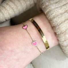 Calling all heart-lovers! The trendiest way to wear your heart on your sleeve. Available in a variety of colors!14K Yellow Gold5 Bubblegum Pink HeartsChain Length: 7 inchesEach heart measures: 7 millimetersThis piece is identical on both sides Lobster Clasp // Heart Graphic Jewelry For Valentine's Day, Trendy Rose Gold Heart Bracelet For Valentine's Day, Trendy Rose Gold Heart Bracelet, Pink Heart Bracelet With Heart Charm, Pink Heart Charm Bracelet, Elegant Pink Heart Friendship Bracelet, Trendy Heart Charm Bracelet For Valentine's Day, Valentine's Day Yellow Gold Heart Bangle Bracelet, Valentine's Day Heart Bracelet For Friendship