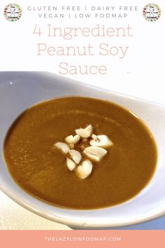 a white bowl filled with soup on top of a table