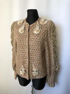 Size EUR 44. Would fit slightly better for sizes 40 or 42 as oversize All measurements are in centimiters Length 59 Chest 53 Waist 52 Bottom 54 Shoulders 40 Sleeve 68 Vintage Brown Cardigan For Spring, Vintage Floral Embroidered Long Sleeve Cardigan, Beige Cardigan With Floral Embroidery For Fall, Beige Floral Embroidered Cardigan For Fall, Fitted Beige Cardigan For Spring, Vintage Embroidered Sweater For Spring, Vintage Floral Embroidered Sweater For Spring, Beige Embroidered Cardigan For Spring, Spring Beige Embroidered Cardigan