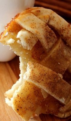 an apple pie is cut in half on a cutting board