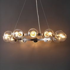 a modern chandelier with eight lights hanging from the ceiling