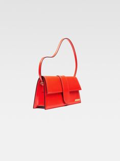 Long flap bag. Bambino Jacquemus, Jaquemus Bag Le Grand Bambino, Jacquemus Le Bambinou Bag, Jacquemus Orange, Jacquemus Le Chiquito Long, Jacquemus Le Bambino Long, Jacquemus Yellow Bag, Mini 8, Mens Essentials