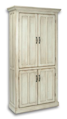 an old white cabinet with two doors