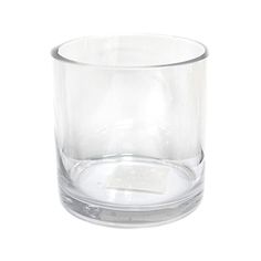 a clear glass is sitting on a white surface