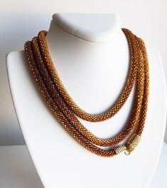 Beaded long necklace, Gold snake necklace, Handmade jewelry, Snake jewelry for women, Brown and gold Adjustable Handmade Yellow Gold Beaded Necklaces, Multi-strand Gold Beads Jewelry Gift, Gold Double Strand Handmade Necklace, Handmade Gold Double Strand Necklace, Gold Handmade Double Strand Necklace, Gold Beads Double Strand Necklace As Gift, Handmade Multi-strand Chain Necklace Gift, Gold Double Strand Beaded Necklace For Gift, Unique Gold Beaded Chain Necklace