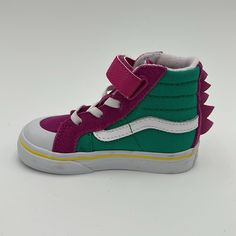 New Vans Kids Purple & Green Dino Sk8-Hi Reissue 138 V Little Kids Sneakers New With Tag / Without Box High-Top Paneled Suede And Canvas Sneakers In Purple And Green. Graphic Appliqus At Vamp And Heel. Round Rubber Cap Toe Elasticized Lace-Up And Velcro Closure Padded Tongue And Collar Treaded Rubber Outsole In Tan Supplier Color: Dino Fuchsia Red/Pepper Green Vans Us Size: Child's Foot Length 10.5: 6.125 / 15.6 Cm 11: 6.25 / 15.9 Cm 11.5: 6.375 / 16.2 Cm 12: 6.625 / 16.8 Cm 12.5: 6.75 / 17.1 Cm 13: 6.875 / 17.5 Cm 1: 7.25 / 18.4 Cm 1.5: 7.375 / 18.7 Cm 2: 7.5 / 19.1 Cm 2.5: 7.625 / 19.4 Cm 3: 7.875 / 20 Cm Upper: Leather, Textile. Sole: Rubber Playful Purple Low-top Sneakers, Green Sneakers With Rubber Sole For Playtime, Vans Sporty Non-slip Sneakers, Sporty Purple School Sneakers, Sporty Non-slip Vans Sneakers, Purple Vans Slip-on Sneakers, Purple Vans High-top Sneakers, Sporty Purple Vans Skate Shoes, Purple Slip-on Vans Sneakers