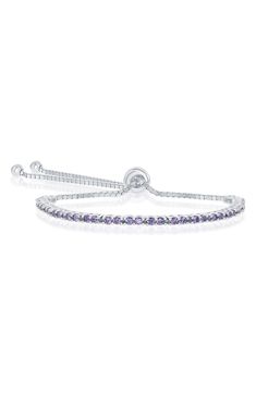 Amethyst inspired cubic zirconia stones add sparkle to this elegant sterling slver bolo bracelet. 9" length, 0.3" width Sliding bead clasp Sterling silver/cubic zirconia Imported Adjustable Tennis Bracelet With Sparkling Stones, Purple Jubilee Tennis Bracelet, Adjustable Silver Cubic Zirconia Tennis Bracelet, Elegant Silver Tennis Bracelet With Amethyst, Elegant Silver Amethyst Tennis Bracelet, Purple Cubic Zirconia Anniversary Bracelets, Purple Cubic Zirconia Bracelet For Anniversary, Purple Cubic Zirconia Bracelets For Anniversary, Amethyst Tennis Bracelet As A Gift