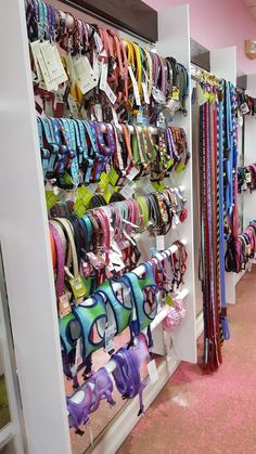 there are many ribbons on display in the store, and one is hanging from the wall