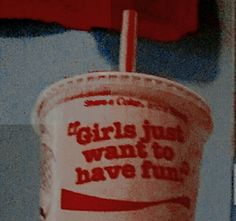 a cup with a straw in it that says girls just want to have fun