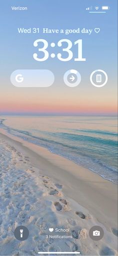 an iphone screen showing the time and weather in front of a beach with footprints on it