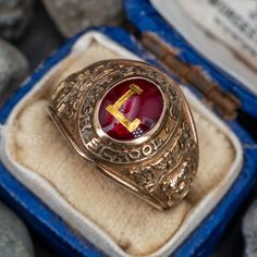 This vintage 1959 Lyons High School class ring is centered with a bezel set red glass cabochon with the letter "L" in the center. The ring is crafted of 10k yellow gold that has a great patina to it. Class Rings High School, Antique Cocktail Ring, Ancient Roman Jewelry, Roman Jewelry, High School Classes, School Class, Letter L, Ancient Romans, Men's Jewelry