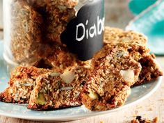 some granola bars are on a plate with a chalkboard that says did you eat them?