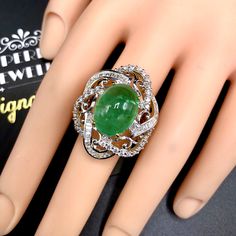 "ENJOY OUR WORRY-FREE SERVICE AND THE DAZZLING, GENUINE JEWELRY WE DESIGN AND HANDCRAFT WITH LOVE❤️ ABOUT THE ITEM: This ring is the perfect combination of elegance, beauty, and INVESTMENT VALUE! With a TRANSPARENT, Cabochon 12.08 carats, VIVID FOREST GREEN emerald, and 83 extremely sparkling diamonds. The ring was deliberately designed and handcrafted by our boutique's in-house goldsmiths. You will love this gorgeous piece as much we do. And people will absolute adore it once they see the spark Fine Jewelry White Gold Emerald Cabochon Ring, White Gold Cabochon Emerald Ring Fine Jewelry, Fine Jewelry White Gold Cabochon Emerald Ring, Luxury White Gold Oval Cabochon Emerald Ring, Formal Emerald Cabochon Diamond Ring, Luxury Emerald Cabochon Ring For Wedding, Luxury Emerald Cabochon Ring With Diamonds, Luxury Cabochon Emerald Ring For Wedding, Emerald Cabochon Diamond Ring For Anniversary