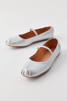 UO Mila ballet flats. Essential ballet flats from UO in soft faux leather. Slip-on silhouette with a folded round toe & Mary Jane strap for an authentic feel. Features UO Mila ballet flats Faux leather ballet flats Mary Jane strap Rounded toe Lightweight Slip-on flats style UO exclusive Content + Care PU Wipe clean Imported | Urban Outfitters UO Mila Mary Jane Ballet Flat in Silver, Women's at Urban Outfitters Spring Ballet Flats With Soft Sole, Closed Toe, Spring Ballet Flats With Soft Sole, Spring Leather Ballet Flats With Soft Sole, Silver Ballet Flats, Leather Ballet Flats, Ballet Flat Shoes, Ballet Flat, Ballet Flats, Loafer Flats